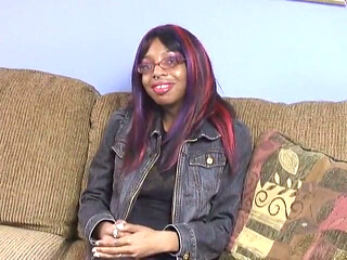 Black Chick with Nipple Rings on Her Big Tits Spreads Her Legs on the Couch
