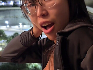 Horny Asian babe with nice ass gets bent over the balcony and fucked doggystyle