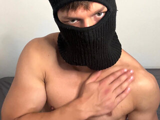 Masked horny hunk oiled up and teasing