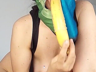 The Sexy Brunette Sucks the Banana