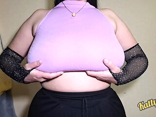 MILF Mom shakes her massive natural tits in pink clothes while teasing the