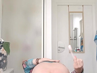 Naked with her buttocks in the air