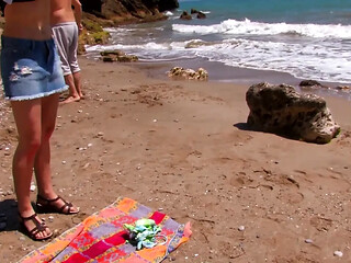 She enjoys two cocks at the sea fucking all her holes