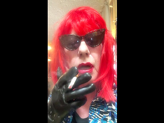 MRS. ROMAN DESTROYING A MARLBORO 100 MENTHOL CLOSE UP - WITH DANGLING AND NOSTRIL EXHALES