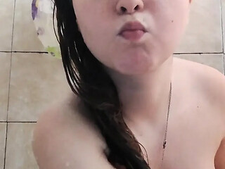 Shapely tattooed teen gives a SOAPpy shower ride