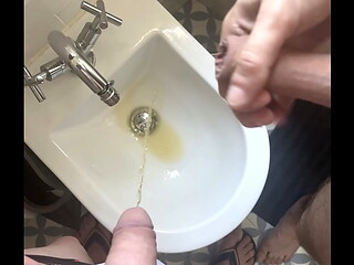 2 amateur boys flatmates (1 ginger, circumcised, with undies and flip flops, 1 naked uncut) pissing together in a bidet