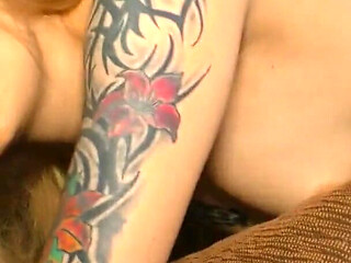 Tattooed blonde gets a warm load on her small tits