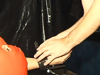 Mature mom gets her big tits out in a sexy corset while heavy clamps are