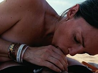 Hot milf swallows cum after giving a public beach blowjob