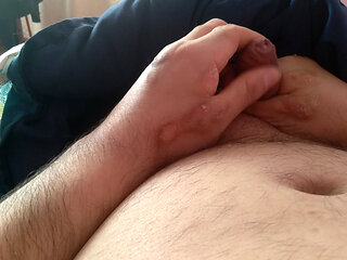 Young man with a large penis masturbates well