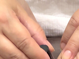 Pretty Girl Grooming Her Cute Feet with Fresh Nail Polish