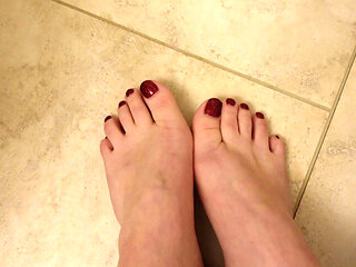 Quick New Pedicure Show off Glittery Red Toenails