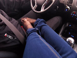 Amateur MILF in jeans and nylon socks gives a taxi driver a footjob