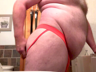 Fat Chub plays with dildo wearing a jock in his bathroom
