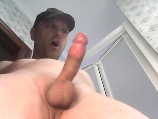 Unloading a nice load while standing in the bathroom - tight shaved balls