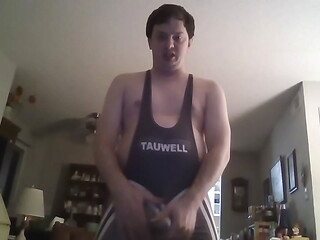 Young Man Playing with His Penis in a Westling Suit and Underwear