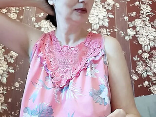 Asian MILF exposes big tits for solo playtime