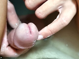 Hot girl plays with her penis in the bathtub, inserts her finger into the urethra
