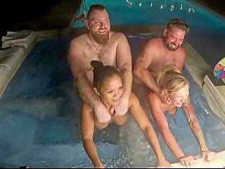 Busty blonde milf and her friend go wild in a hot tub foursome