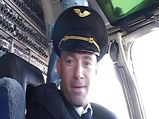 Randy pilot fondles sexy brunette in the cockpit