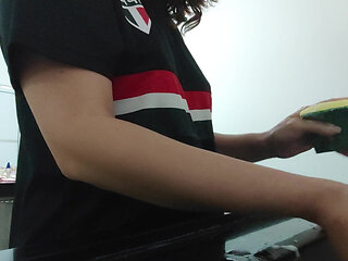 Woman teasing while washing dishes. She loves to transmit to the voyeurs on duty