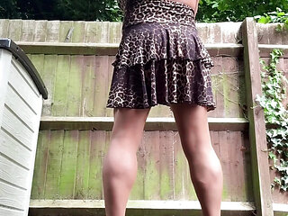 Sexy Crossdresser kellycd2022 in backless leopard print dress and heels in the garden
