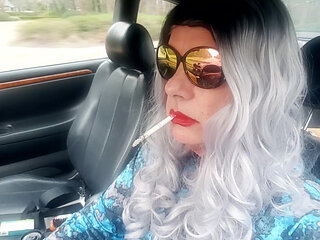 MATURE LOVES TO DRIVE AND SMOKE HER LONG CIGARETTES