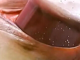 Brunette slut controls orgasm while stuffing her pussy with food and toys