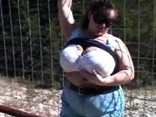 Busty curly brunette with big boobs fucks on couch