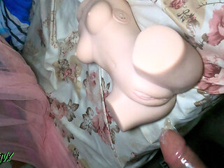 HOT YOUNG WOMAN SHOVING HER COCK INTO THE PUSSY AND ASS OF A SLUT DOLL