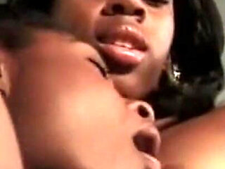 Two Young Black Lesbians with Nice Tits Lick Each Other's Pussy and Enjoy