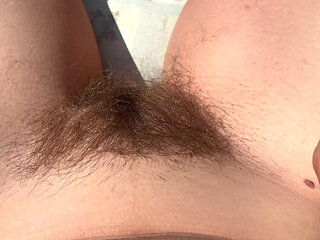 Trimming my bush and my hairy legs closeup outdoor