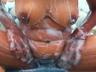 Ammu is showing us by applying soap on huge boobs and sweet pussy