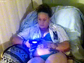 Hot mom shows off her cleavage while playing video games