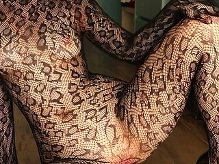I'm Posing in a Black Fishnet Bodysuit and Heels, Pleasuring Myself with My Fingers.