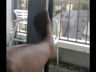wanking at the hotel window