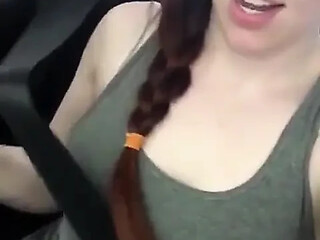 Braless, pale redhead solo fingering for a satisfying car-masturbation orgasm