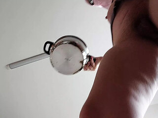 Brunette hairy pussy prepares breakfast naked in the kitchen.
