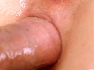 Slowly working his oiled up cock deep into her tender asshole