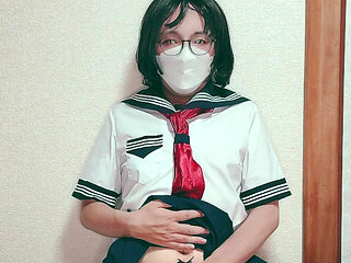 A masturbating ladyboy in a sailor suit
