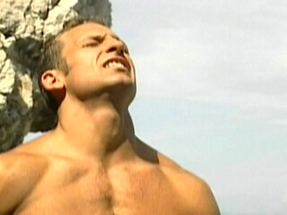 Two Hung Muscle Studs Pound a Young Jock Anal on the Sand in