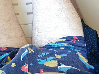Masturbating outside lying on a plastic bed