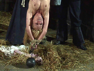 Witch Hangs Upside Down and Gets Drizzled with Black Wax