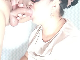 Mature woman sucking with eye mask