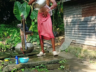 Desi young man bath Open place.