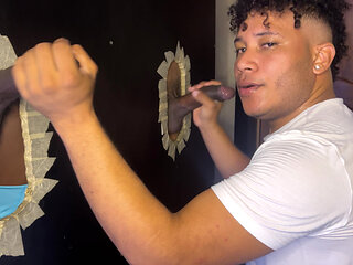 Sucking  in the glory hole to these two BBC