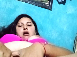 Chubby Latina with big tits chews her rich wet pussy