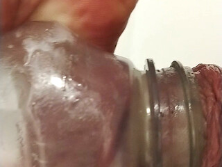 Pumping balls and sucking cock in bottle