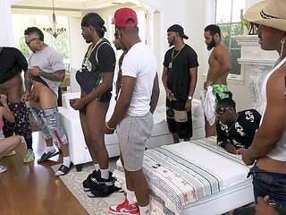 Kylie Quinn gives interracial blowjob to 13 dudes