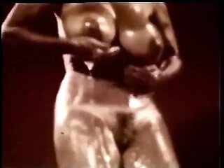 Vintage beauty oils her big tits for solo pleasure